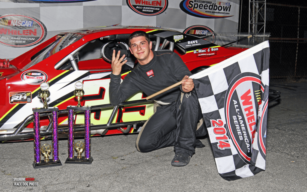 Black and white abstract pattern with concentric circles and wave shapes.