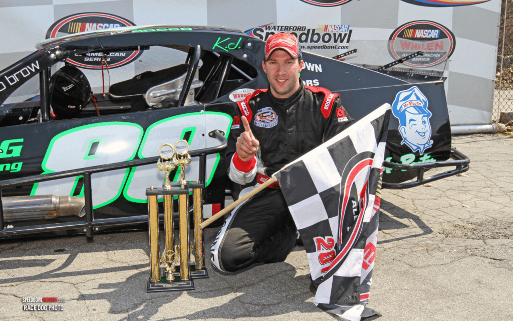 Black and white abstract pattern with concentric circles and wave shapes.