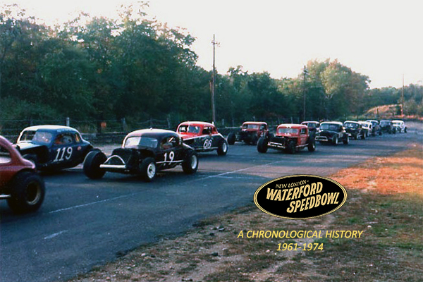 Vintage race cars lined up at Waterford Speedway during a historic event.