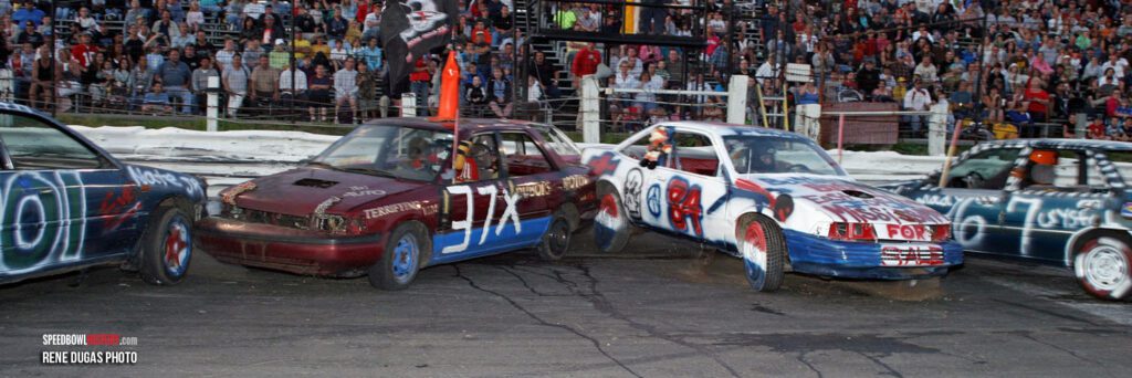 Cars lined up at a race track, ready for a race start.