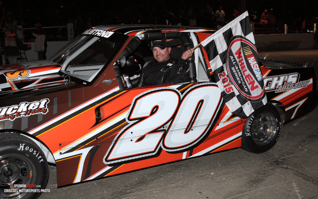 Black and white abstract pattern with concentric circles and wave shapes.