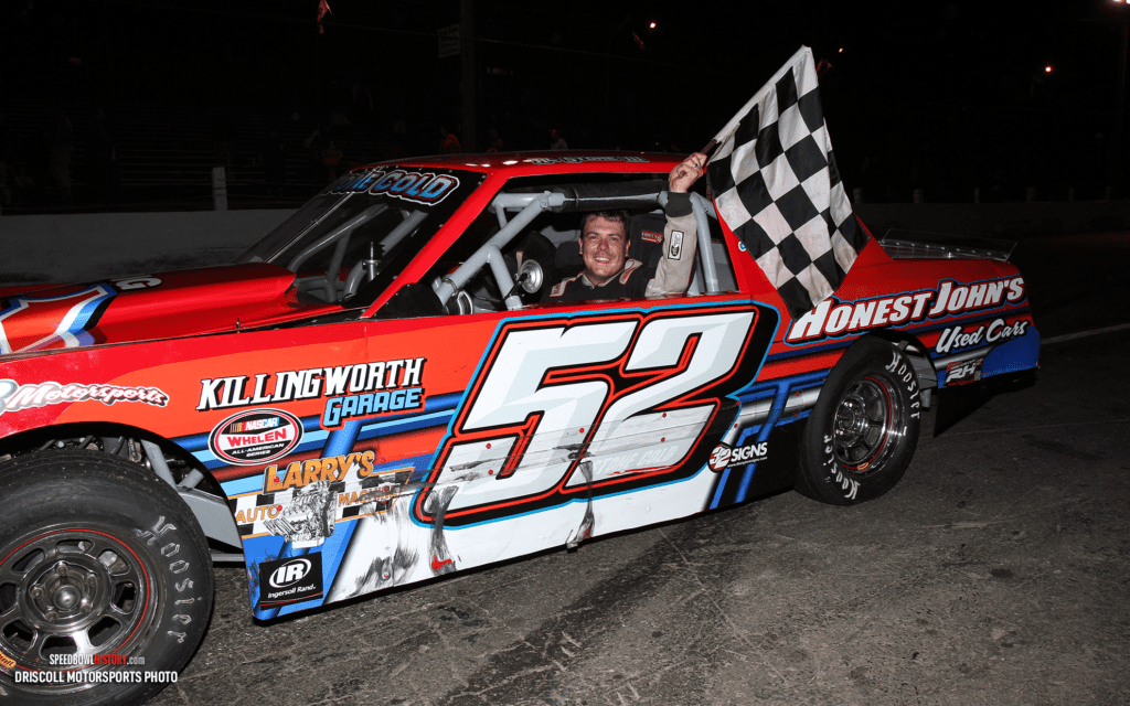 Black and white abstract pattern with concentric circles and wave shapes.