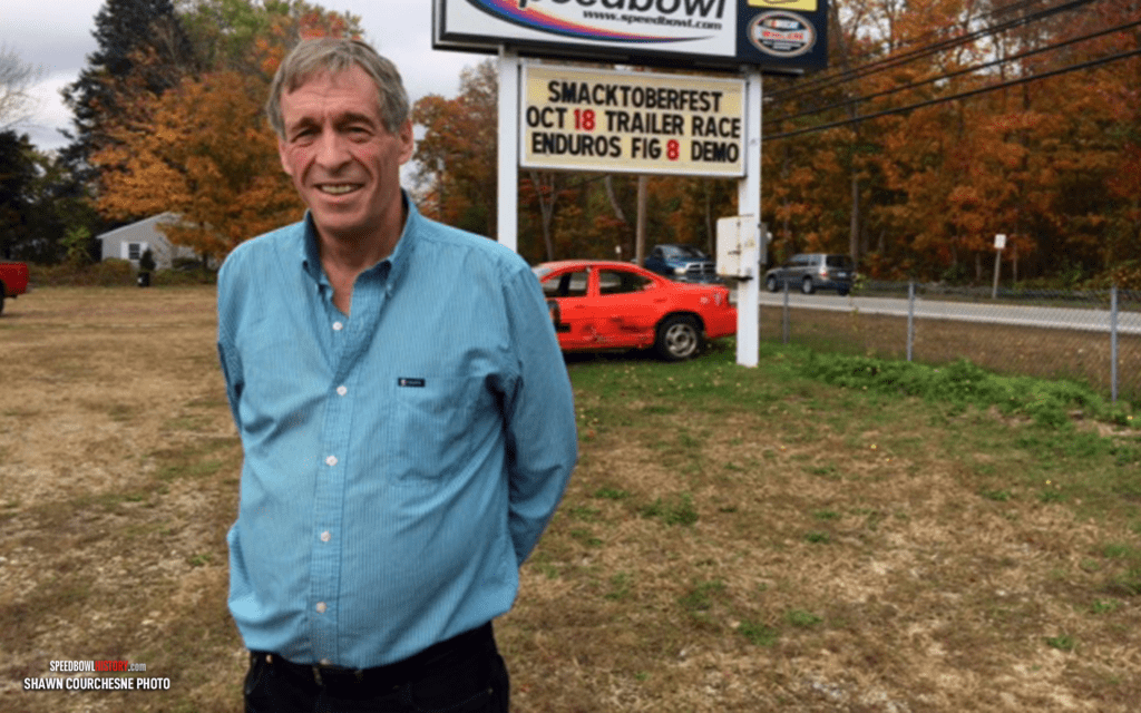 Black and white abstract pattern with concentric circles and wave shapes.