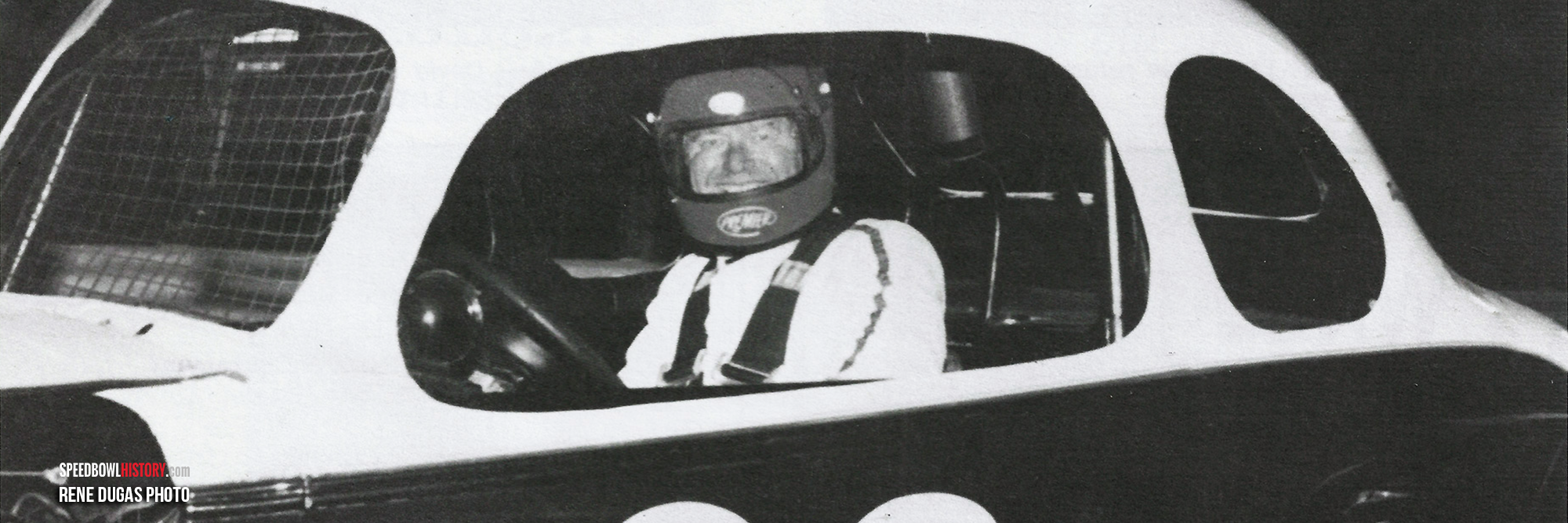 Black and white abstract pattern with concentric circles and wave shapes.