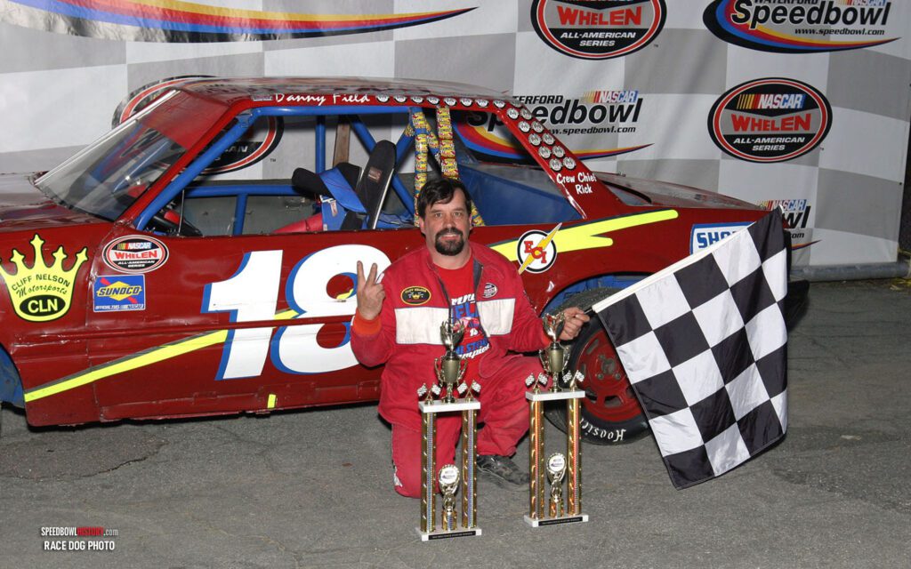 Black and white abstract pattern with concentric circles and wave shapes.