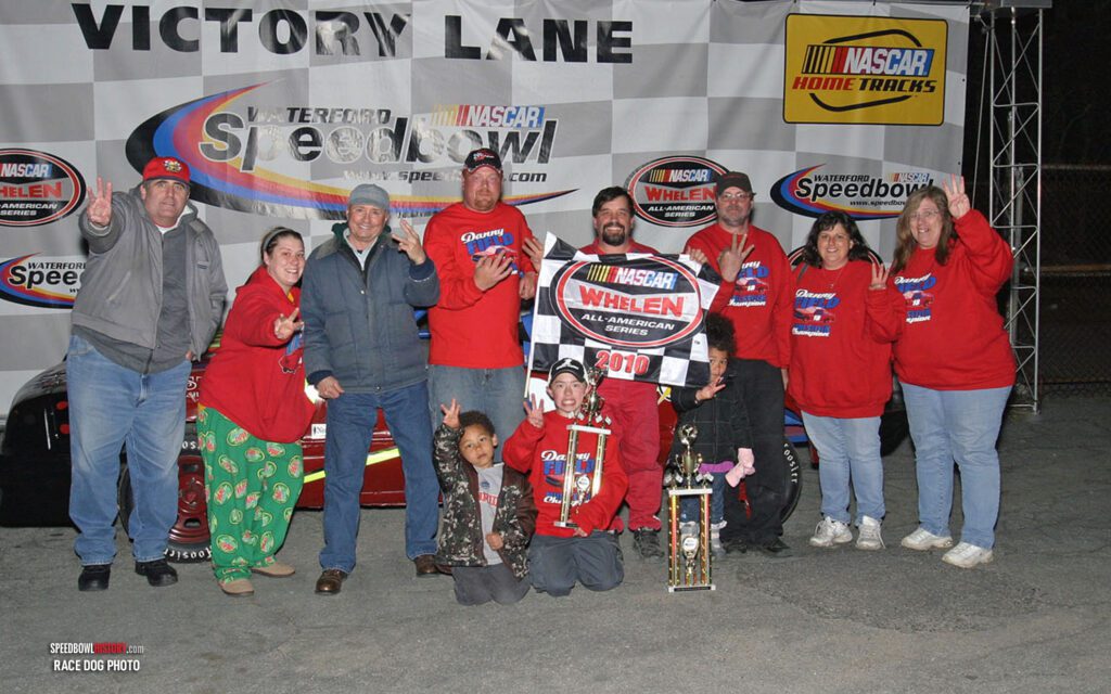 Black and white abstract pattern with concentric circles and wave shapes.