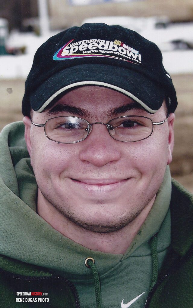 Black and white abstract pattern with concentric circles and wave shapes.