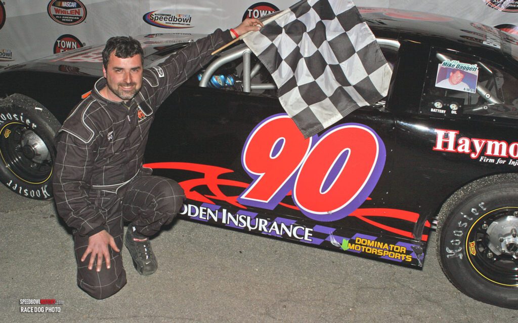 Black and white abstract pattern with concentric circles and wave shapes.