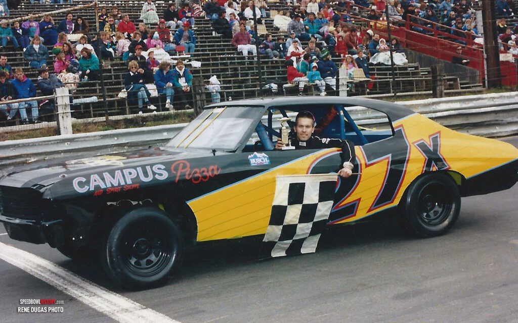 Black and white abstract pattern with concentric circles and wave shapes.