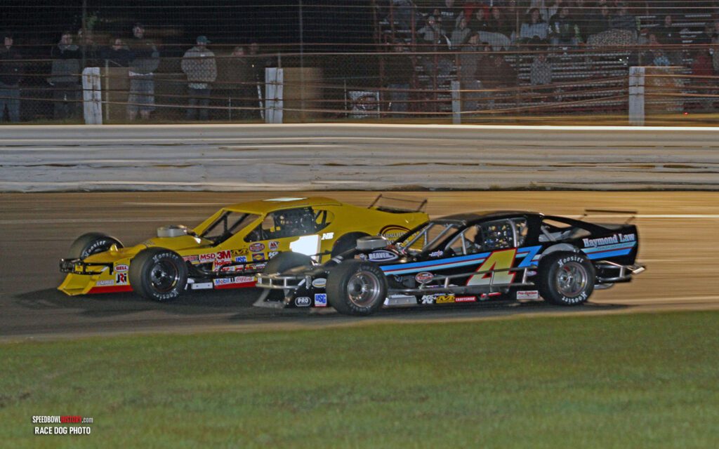 Black and white abstract pattern with concentric circles and wave shapes.