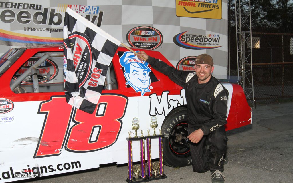 Black and white abstract pattern with concentric circles and wave shapes.