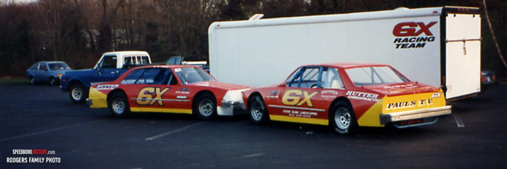 Black and white abstract pattern with concentric circles and wave shapes.