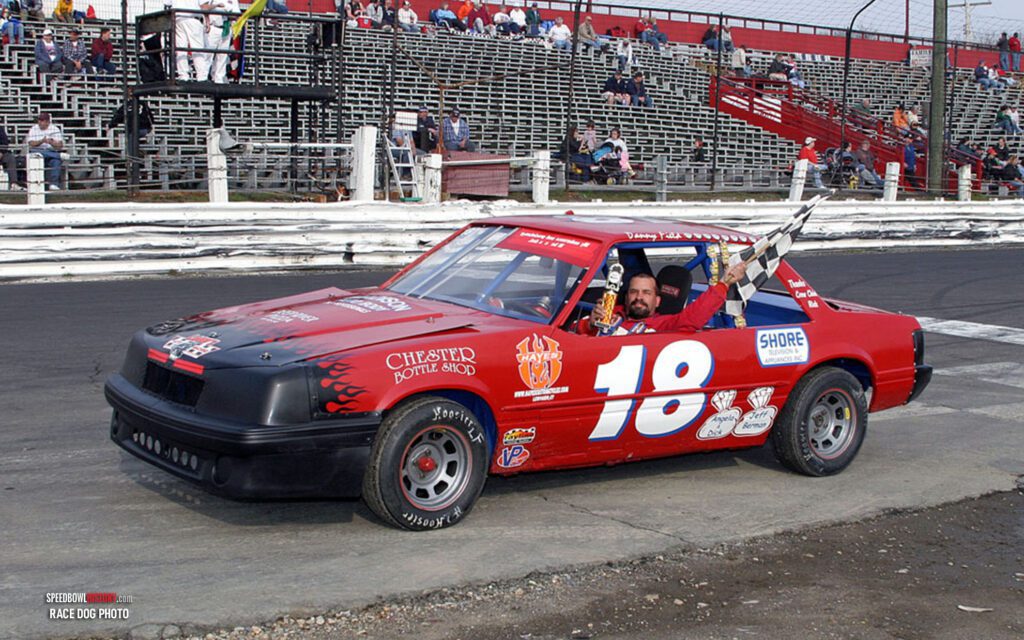 Black and white abstract pattern with concentric circles and wave shapes.