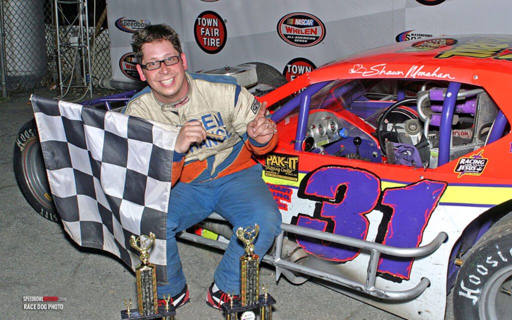 Black and white abstract pattern with concentric circles and wave shapes.