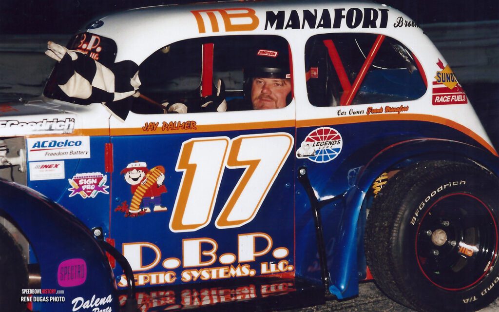 Black and white abstract pattern with concentric circles and wave shapes.