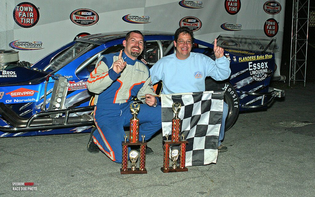 Black and white abstract pattern with concentric circles and wave shapes.