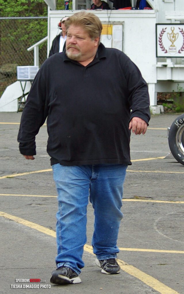 Black and white abstract pattern with concentric circles and wave shapes.