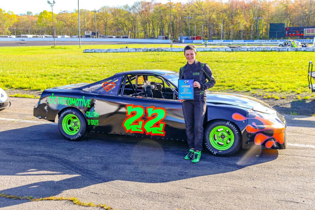 Black and white abstract pattern with concentric circles and wave shapes.