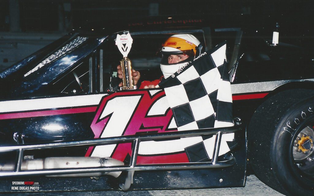 Black and white abstract pattern with concentric circles and wave shapes.