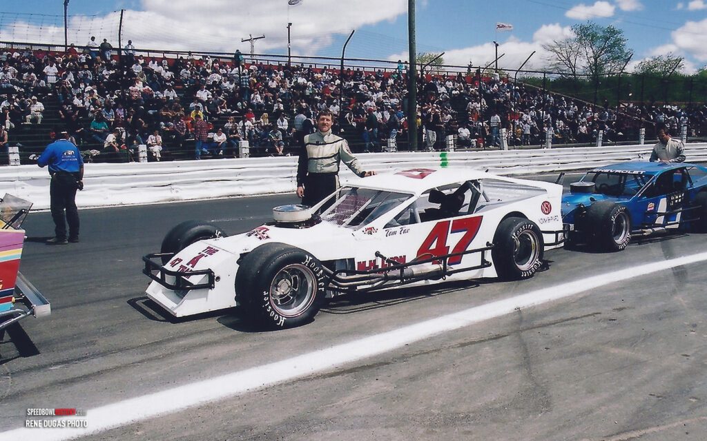 Black and white abstract pattern with concentric circles and wave shapes.