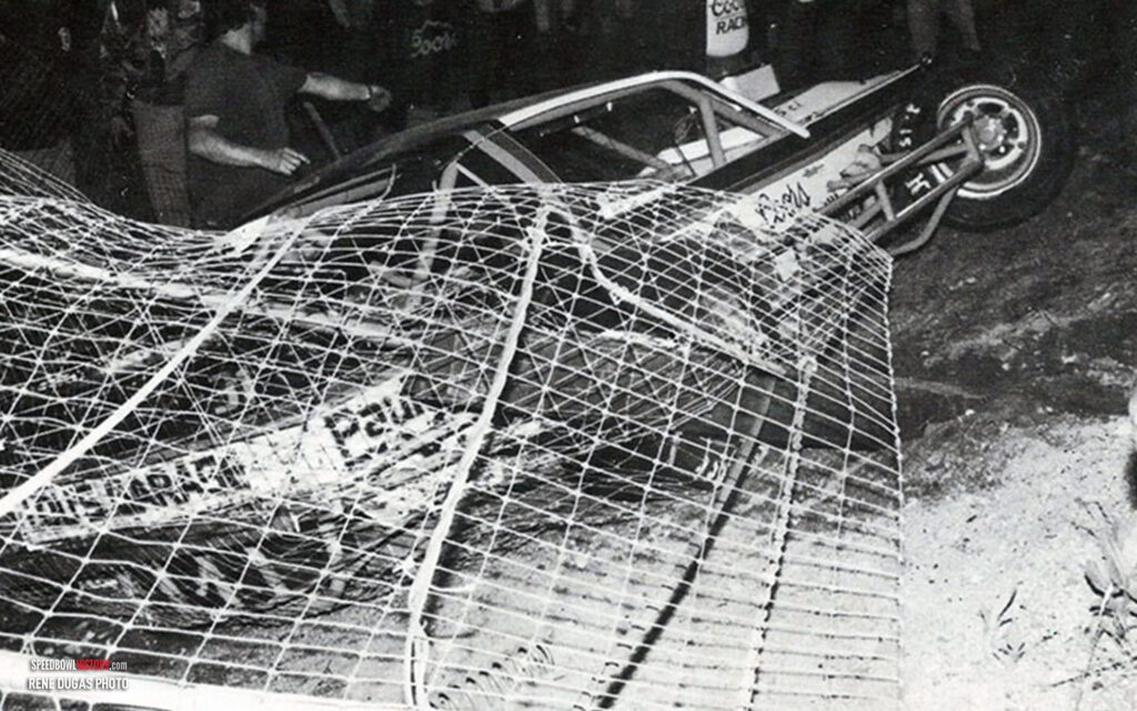 Black and white abstract pattern with concentric circles and wave shapes.