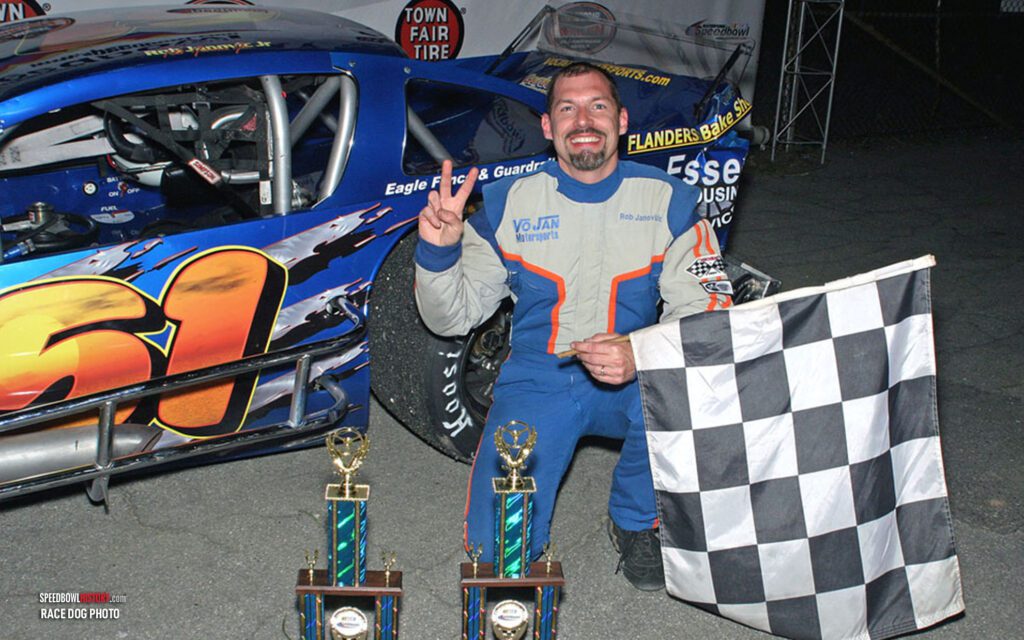 Black and white abstract pattern with concentric circles and wave shapes.