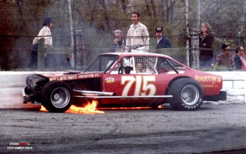 Black and white abstract pattern with concentric circles and wave shapes.