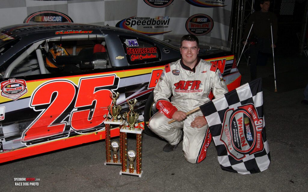 Black and white abstract pattern with concentric circles and wave shapes.