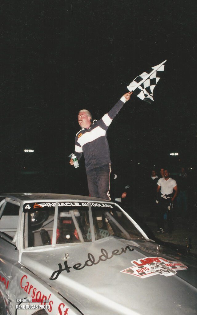 Black and white abstract pattern with concentric circles and wave shapes.