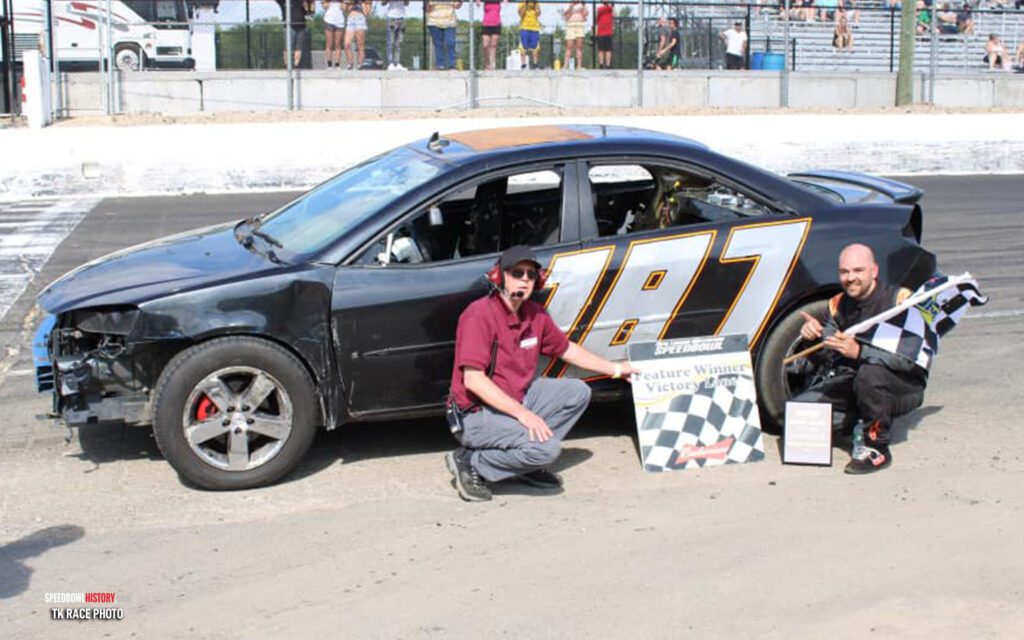 Black and white abstract pattern with concentric circles and wave shapes.
