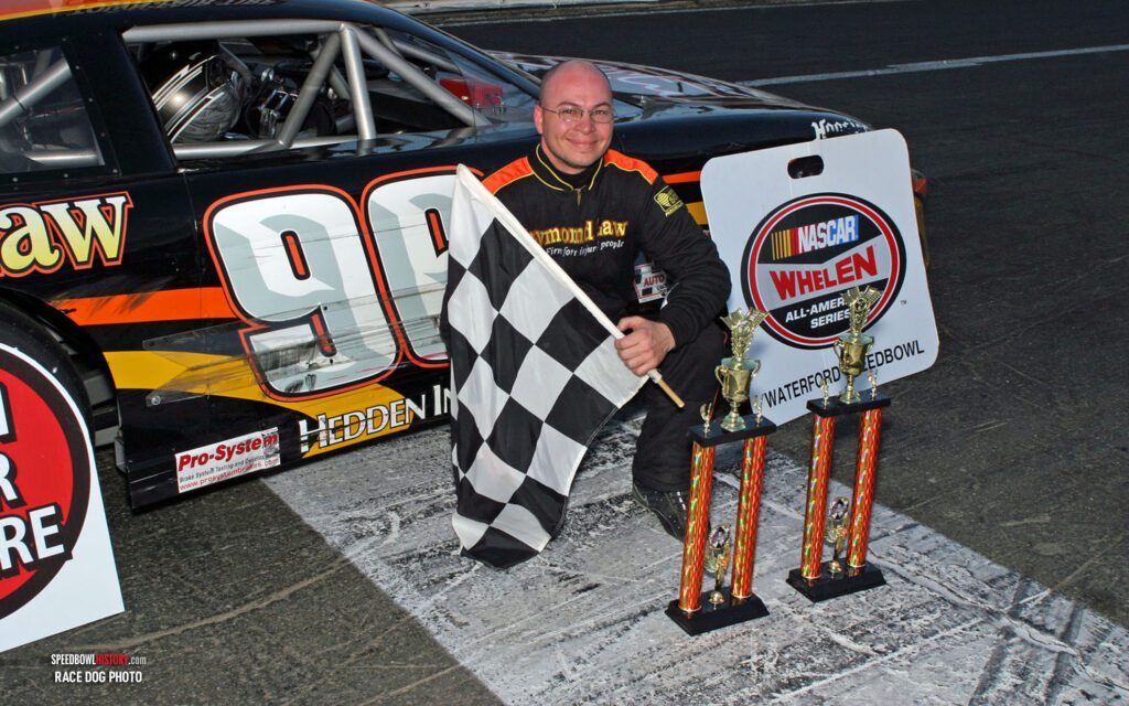 Black and white abstract pattern with concentric circles and wave shapes.