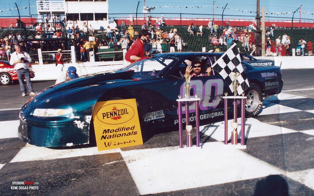 Black and white abstract pattern with concentric circles and wave shapes.