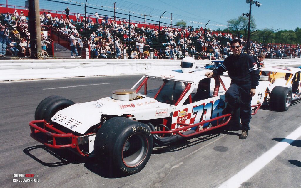 Black and white abstract pattern with concentric circles and wave shapes.