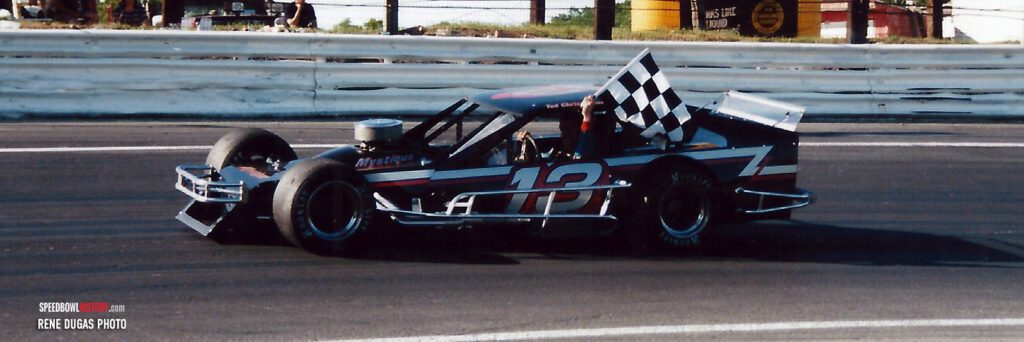 Black and white abstract pattern with concentric circles and wave shapes.