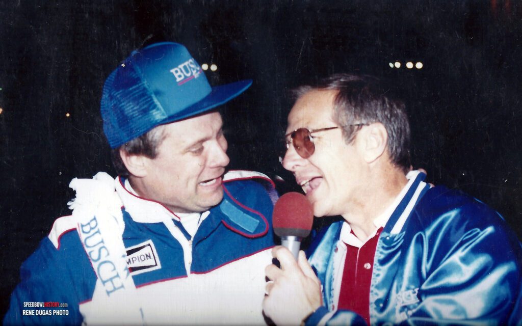 Black and white abstract pattern with concentric circles and wave shapes.