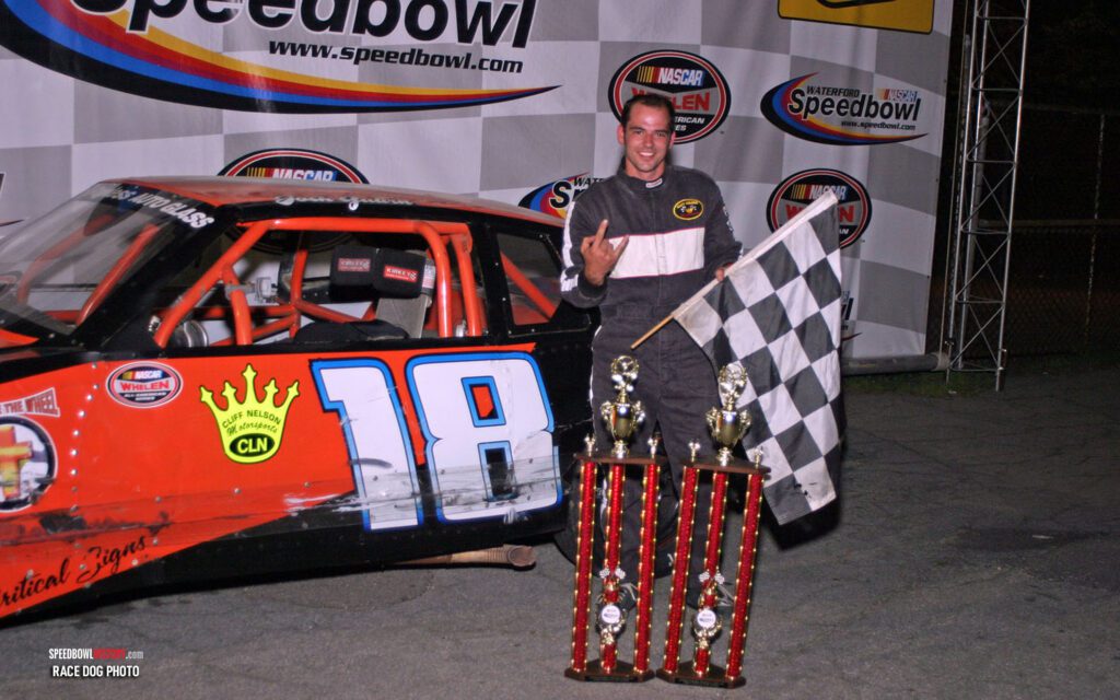 Black and white abstract pattern with concentric circles and wave shapes.