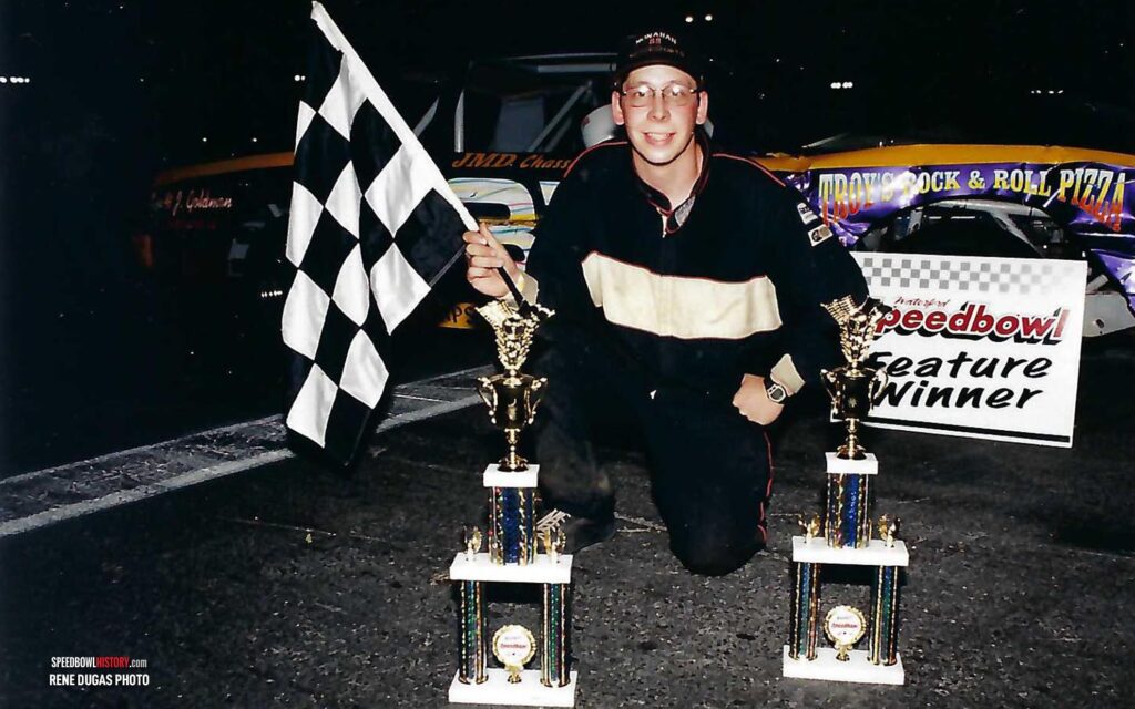 Black and white abstract pattern with concentric circles and wave shapes.