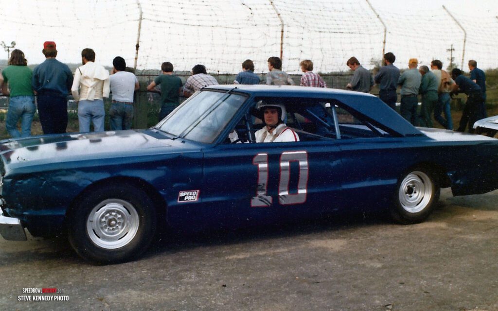 Black and white abstract pattern with concentric circles and wave shapes.