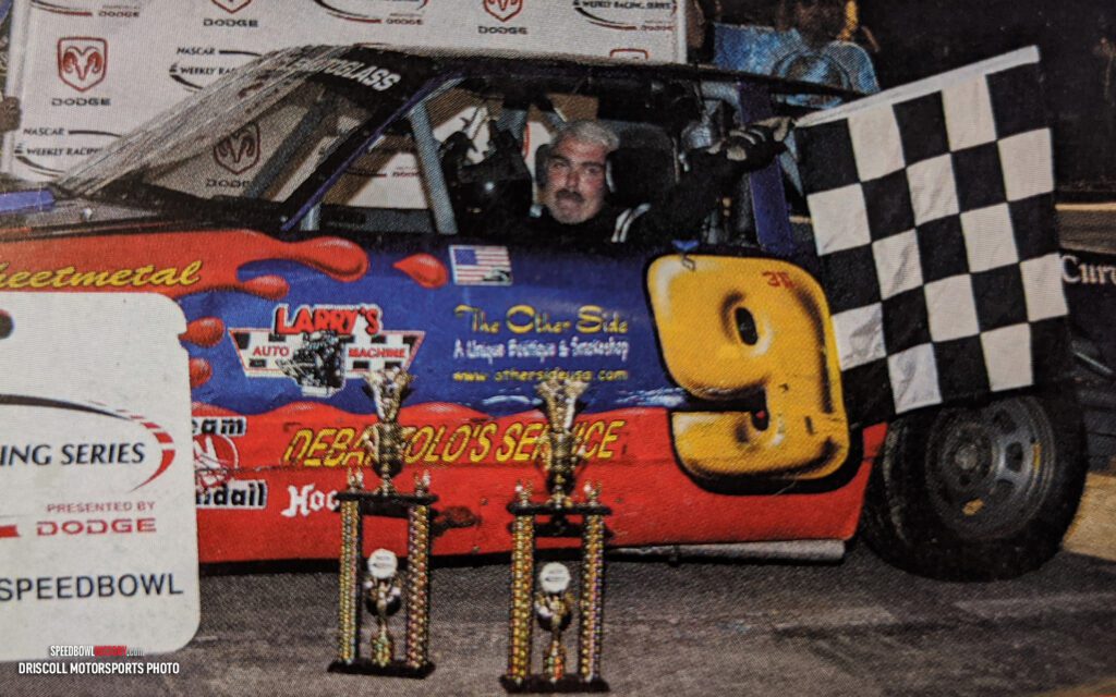 Black and white abstract pattern with concentric circles and wave shapes.