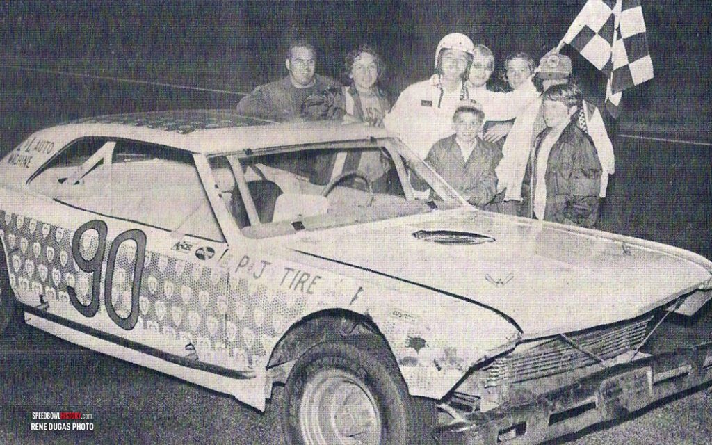 Black and white abstract pattern with concentric circles and wave shapes.