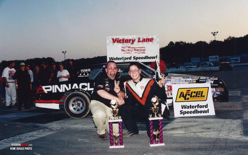 Black and white abstract pattern with concentric circles and wave shapes.