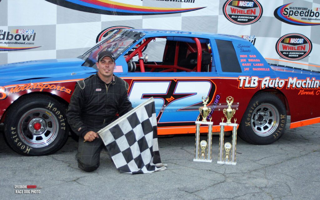 Black and white abstract pattern with concentric circles and wave shapes.