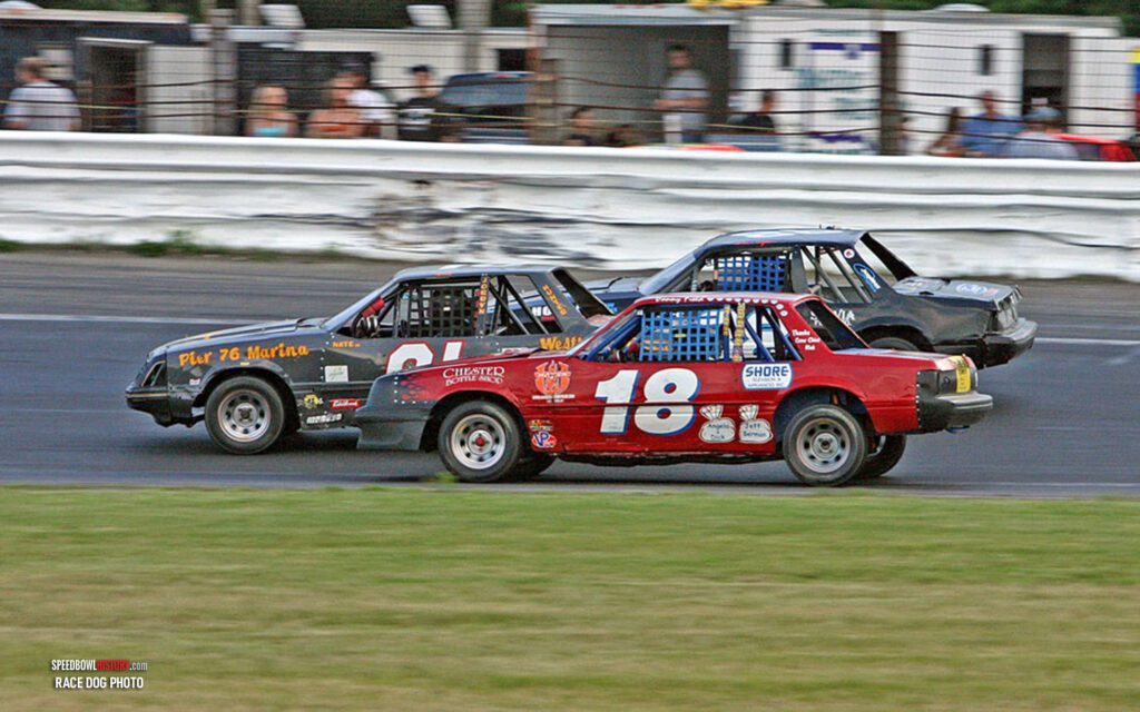 Black and white abstract pattern with concentric circles and wave shapes.