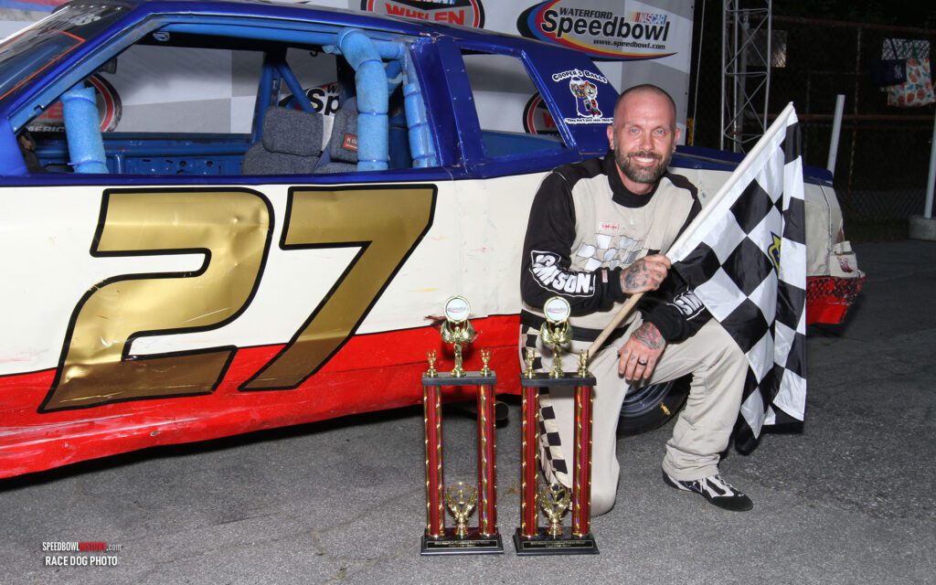 Black and white abstract pattern with concentric circles and wave shapes.