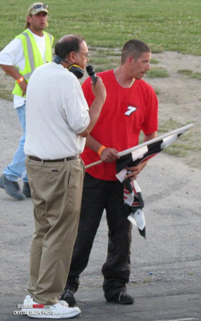 Black and white abstract pattern with concentric circles and wave shapes.