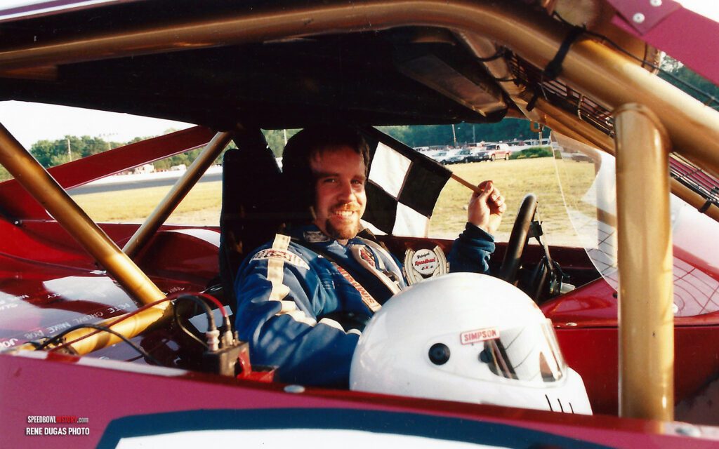 Black and white abstract pattern with concentric circles and wave shapes.