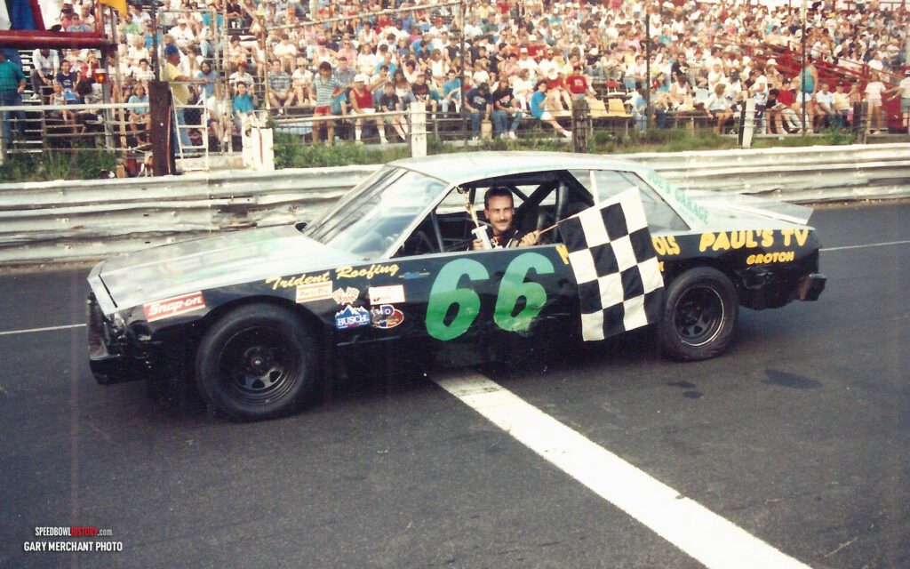 Black and white abstract pattern with concentric circles and wave shapes.