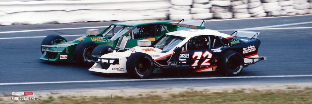 Black and white abstract pattern with concentric circles and wave shapes.