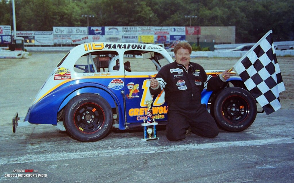 Black and white abstract pattern with concentric circles and wave shapes.