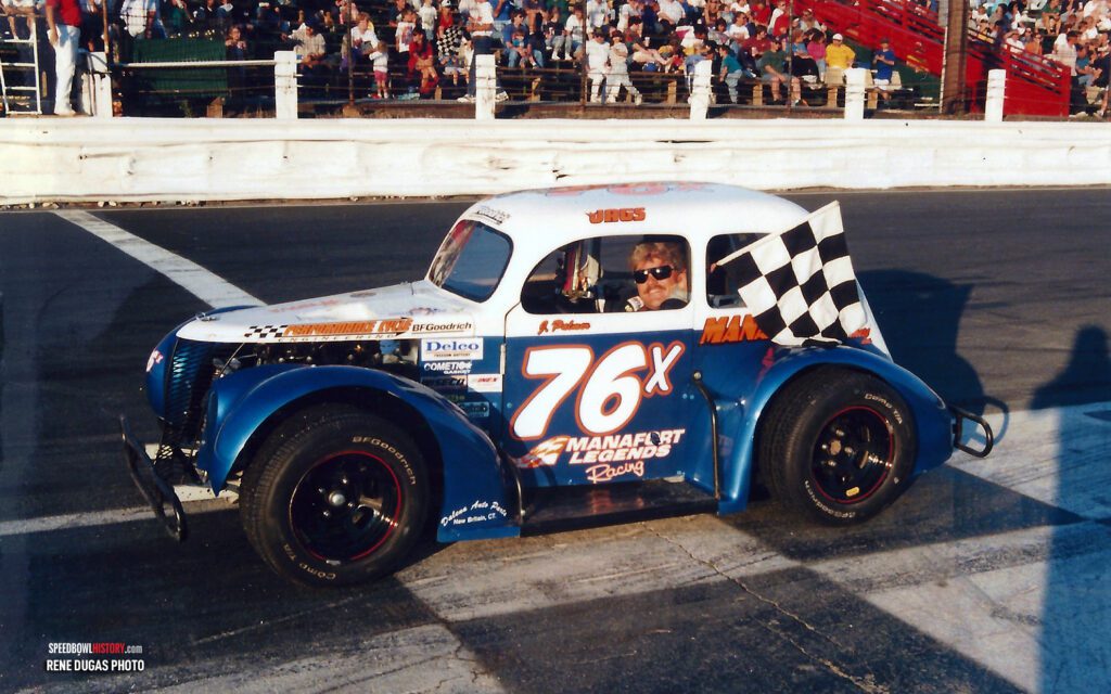 Black and white abstract pattern with concentric circles and wave shapes.